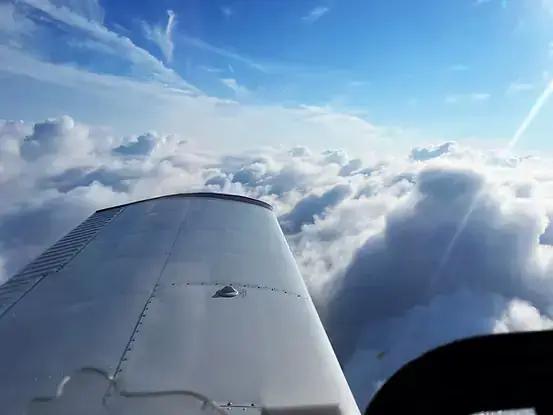 View of the sky from a small airplane window