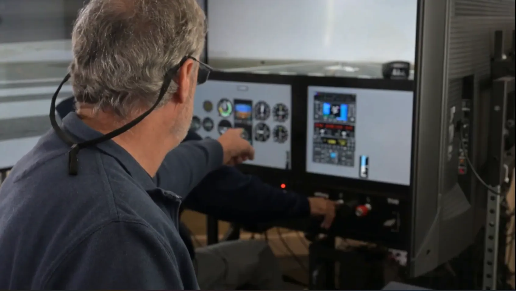Pilot with a headset working through a checklist in the cockpit