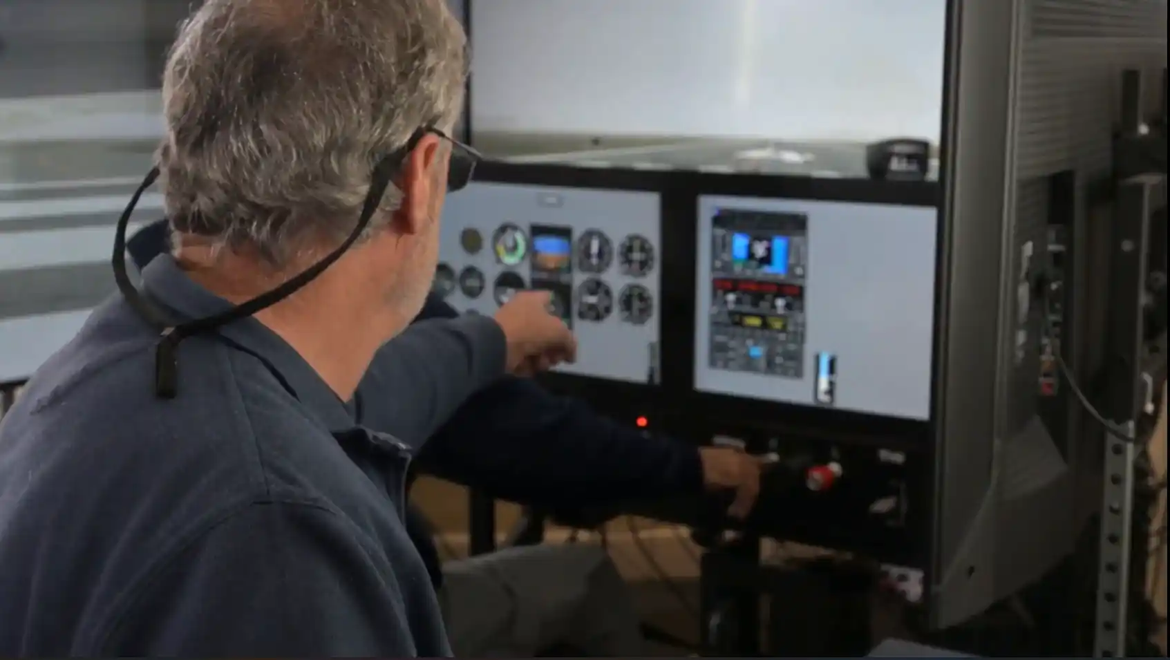 Pilot with a headset working through a checklist in the cockpit