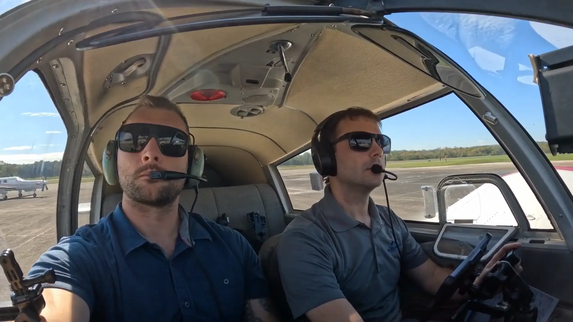 Instructor and student in the training aircraft cockpit during takeoff