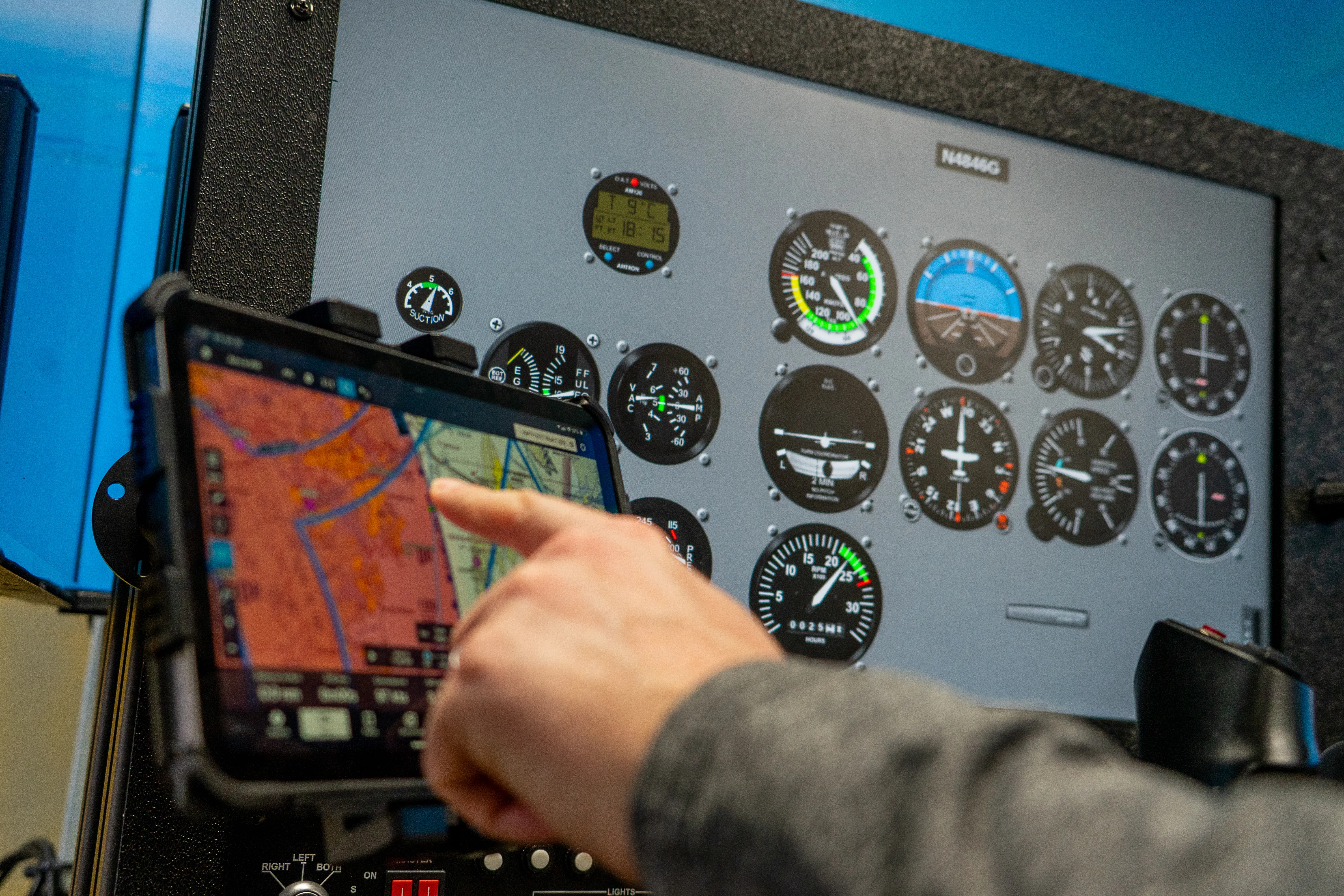 Student pilot working the GPS map screen in the Solid Ground simulator