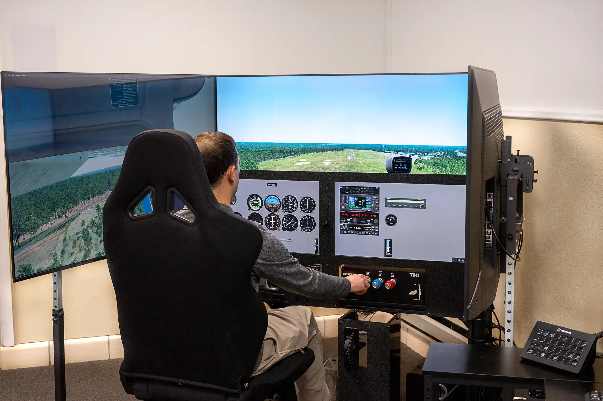 Pilot using the flight simulator at Solid Ground Aviation