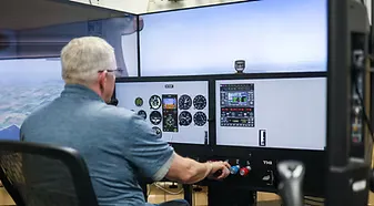 Student flying a lesson in a Solid Ground Aviation simulator in Fort Meade, MD
